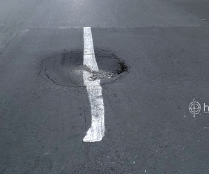Yerevan Municipality Paints Road Markers Over Potholes